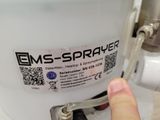 a person holding a plastic container with a sticker on it