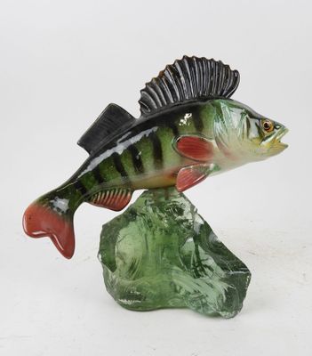 a figurine of a fish with a hat on it ' s head