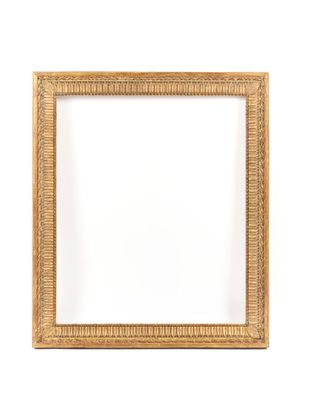 a gold frame on a white wall with a white background
