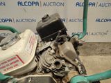 a motor that is sitting on the ground next to a hose