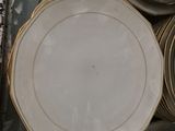 many plates stacked on top of each other on the floor