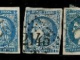 four different blue and white stamps on a black background