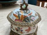 a decorative box sitting on a table in a room