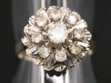 a close up of a ring with a flower design on it