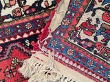 several oriental rugs are laid out on the floor in a room