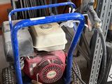a small machine that is sitting in a garage