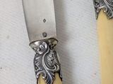 two knives that are sitting next to each other on a table