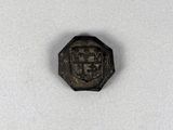 une vieille pièce de monnaie sur laquelle figure l'image d'un homme