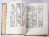 an open book on a table with a white background