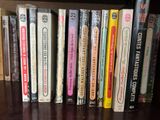 a lot of books that are on a shelf