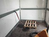a picture of a room with a pallet and a fork in it