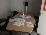 a table with a bunch of papers on it in a room