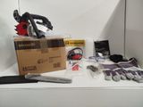 a box of gloves, gloves, and a pair of scissors on a table