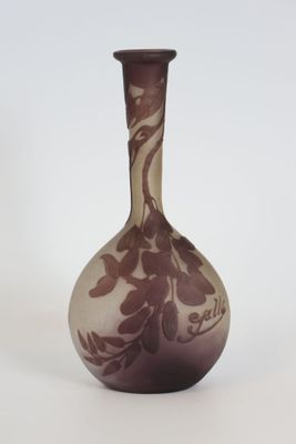 a purple vase that is sitting on a white surface