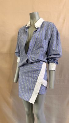 an image of a mannequin dressed in a blue and white shirt and skirt