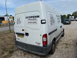 a white van that is parked on the side of the road