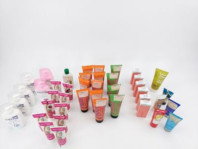 many different types of skin care products on a white surface