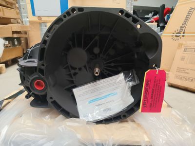 a close up of a blower motor on a box in a warehouse