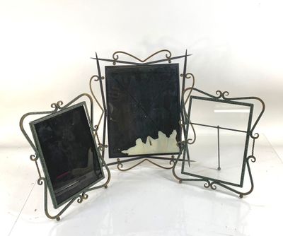 three black and white picture frames sitting next to each other on a white surface