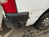 a white truck with a black stripe on the side of it