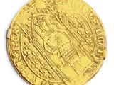 l'image d'une pièce d'or sur laquelle figure l'image d'un homme