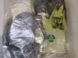 a bag of gloves and a pair of gloves on a table