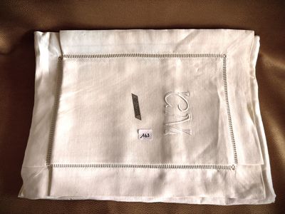 a white napkin with a picture of a teapot and a cup on it