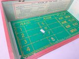 a pink box with a game in it on a table