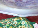 a glass bowl and a glass plate on a table