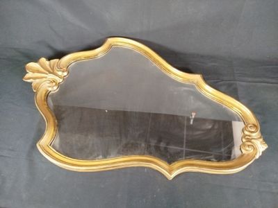 a mirror that is sitting on a black cloth