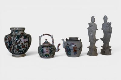 five vases and a teapot sitting next to each other