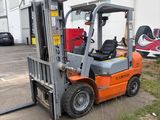 a fork lift truck parked in front of a building