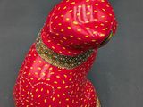 an image of a red cat figurine made out of a strawberry