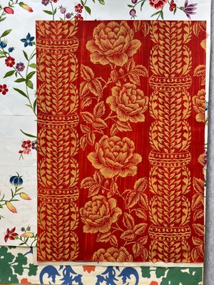 a close up of a piece of cloth with flowers on it