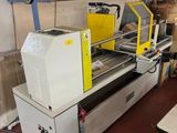 a picture of a machine that is working on a piece of wood