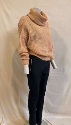 an image of a mannequin wearing a sweater and pants