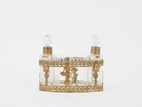 gold and clear glass perfume bottle with a mickey mouse figurine on top