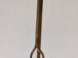 a brass trumpet with a red bow on it