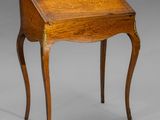 a small wooden desk with a drawer on one side and a drawer on the other side