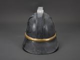 a close up of a helmet with a gold band on it