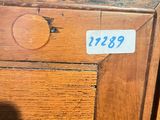 a wooden cabinet with a number on it