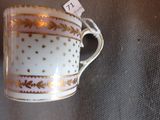 a coffee cup that is sitting on a table