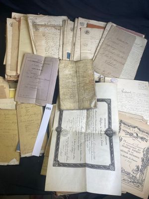 a pile of old papers that are on a table
