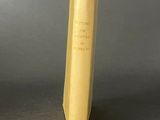 a yellow book that is sitting on a table