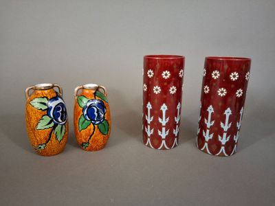 three vases sitting next to each other on a table