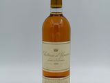 an image of a bottle of wine sitting on top of a table