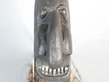 a wooden sculpture of a man with a long beard