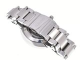 silver metal watch on a white surface with a white background