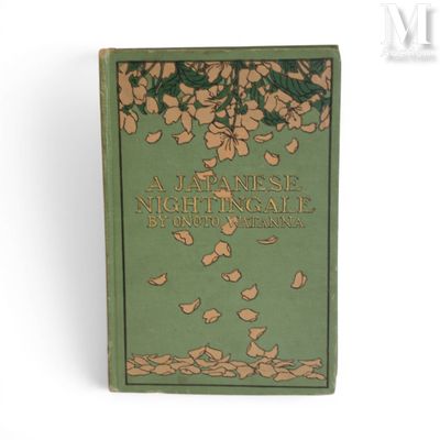 an old green book sitting on top of a table next to a white wall