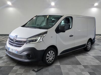 the white van is parked on a checkered floor in a room